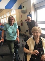 Aravilla Management Group Executive Team assisted living residents out shopping