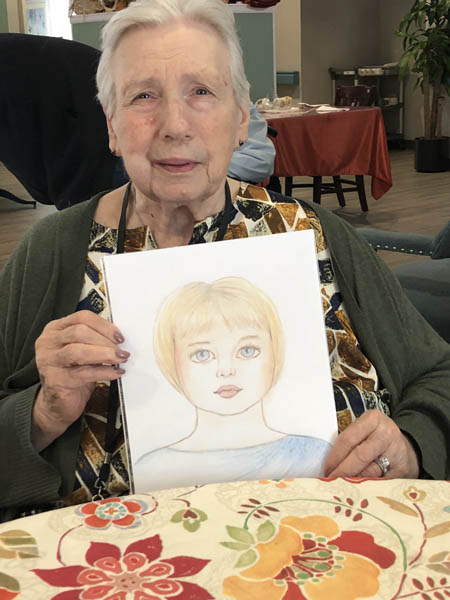 Integrated Memory Care assisted living resident Judy and her artwork