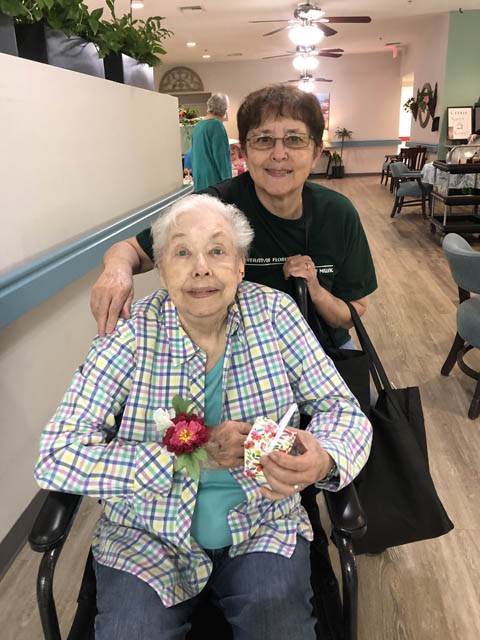 Header assisted living resident ready for family luncheon